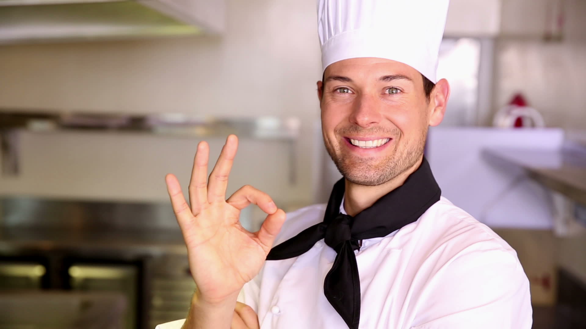 Stock Footage Happy Chef Making Ok Sign To Camera In Commercial Kitchen 